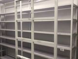 a rack with clothes hanging on it in a room