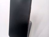 a cell phone that is sitting on top of a stand