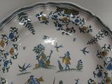 a plate with a picture of a man and a woman on it
