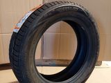 tires are stacked on a cardboard box in front of a cardboard box