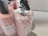 three bottles of lotion sitting on a counter