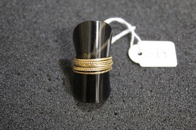 a close up of a ring on a table with a price tag