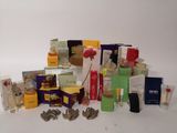 many different types of perfumes on a white surface