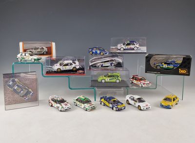a lot of toy cars on display in a display case
