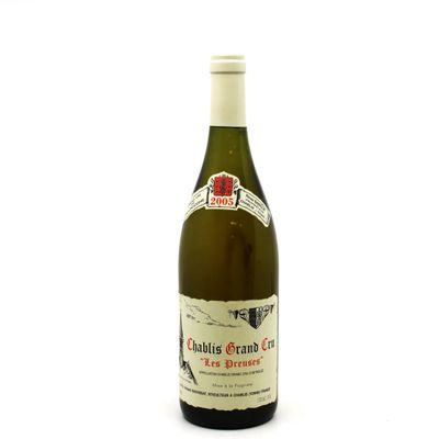a bottle of wine that is sitting on a table