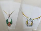 many different types of jewelry displayed on a table