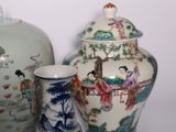 four vases and a bowl sitting on a table