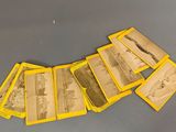 several old photographs of people are arranged in a row on a table