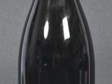 a bottle of wine that is sitting on a table