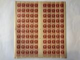a close up of a pair of red and brown stamps on a white background