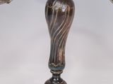 a close up of a table with a vase on it