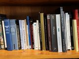 a book shelf with many books on top of it