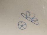 a white plate with a blue design on it