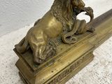 antique brass lion on a marble base