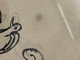 a drawing of a man with a mustache on a piece of paper