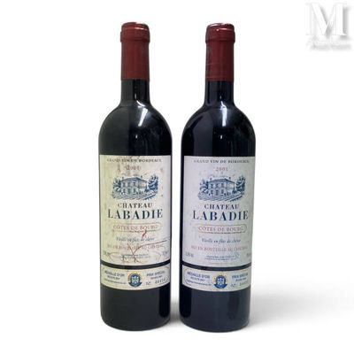 two bottles of wine that are sitting next to each other
