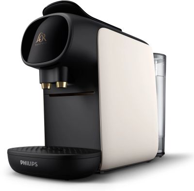 a close up of a coffee maker with a glass of water
