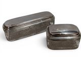 pair of antique silver plated boxes on a white background
