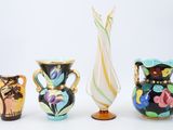 three vases that are sitting next to each other on a table