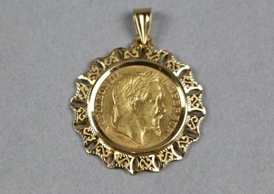 an image of a close up of a gold coin in a pendant