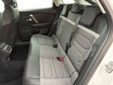 the back seats of a car are empty and the seats are empty