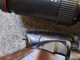 a close up of a rifle with a camera attached to it