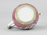 an image of a pink and green teapot with two handles