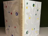 a picture of a white book with a design on it