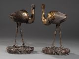 paire de sculptures en bronze représentant deux oiseaux perchés sur un rocher