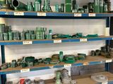 many shelves of green and blue items on the shelves
