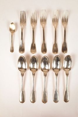 a lot of silver spoons and forks on the table