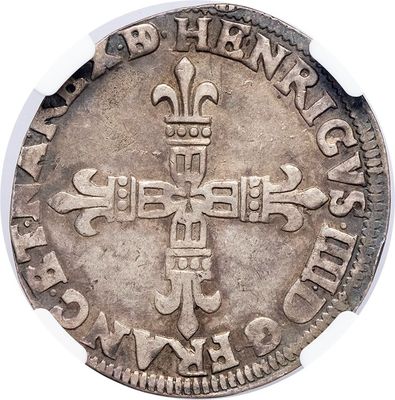an image of a silver coin with a cross on it