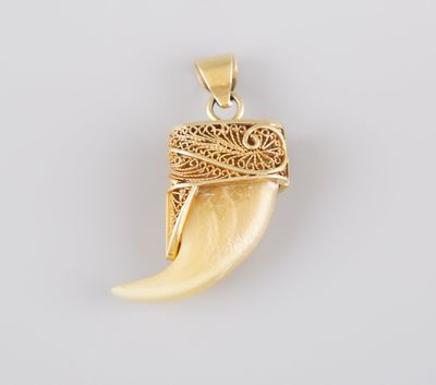 a close up of a pendant on a white surface