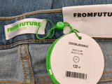 the back of a pair of blue jeans with a green tag on it
