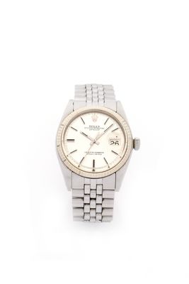 a close up of a wrist watch on a white surface