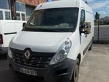 the white van is parked in front of a brick building