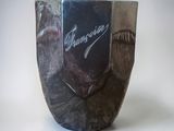 a vase with a picture of a man on it