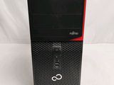 the computer is sitting on a white surface with a red trim