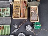 many different types of fly fishing equipment in the box
