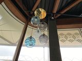 a clock that is hanging from the ceiling of a building