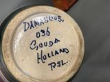 a close up of a jar with writing on it