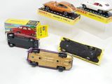 four toy cars that are on display in a display case