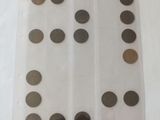 a close up of a sheet of plastic with coins on it
