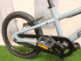 a close up of a bicycle with a chain attached to it