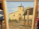 a picture of a painting of a church on a easel