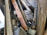 many different types of saws in a metal container
