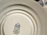 a white plate with a blue and white design on it