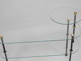 glass and brass coffee table with three glass shelves on each side