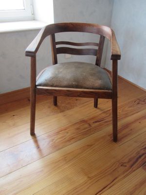 a chair that is sitting on a hard wood floor