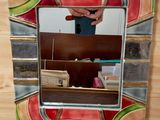 a picture of a person taking a picture of themselves in a mirror